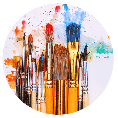 Art brushed covered in paint with colour splashes